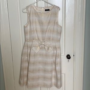 Cream colored with gold accents